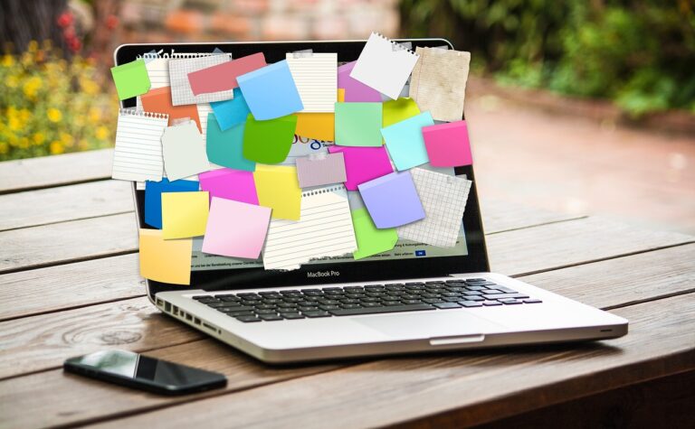 post-it notes, laptop, reminders